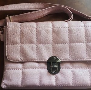 Cute light pink bag/purse. Has an adjustable strap